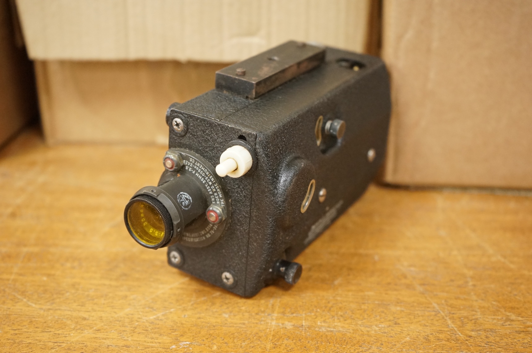 A collection of militaria including; a US Air Force camera Type N-6, a leather cased Bell & Howell Sportster camera and accessories, a pair of periscope binoculars, a leather cased compass by Goerz, Berlin